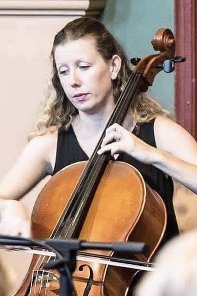 Julienne teaching a student Cello