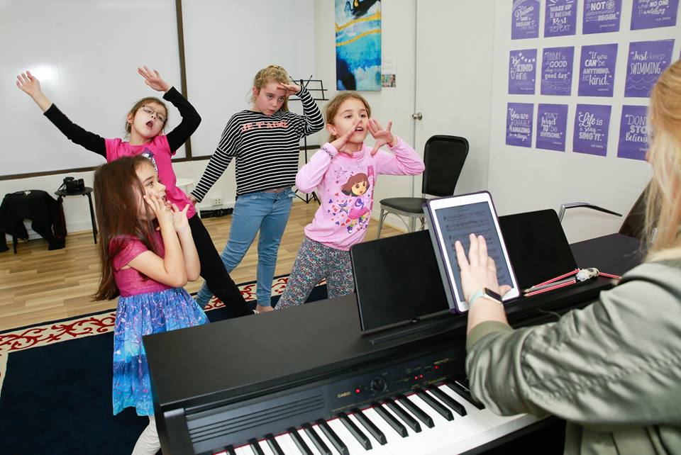 Children singing and practising music