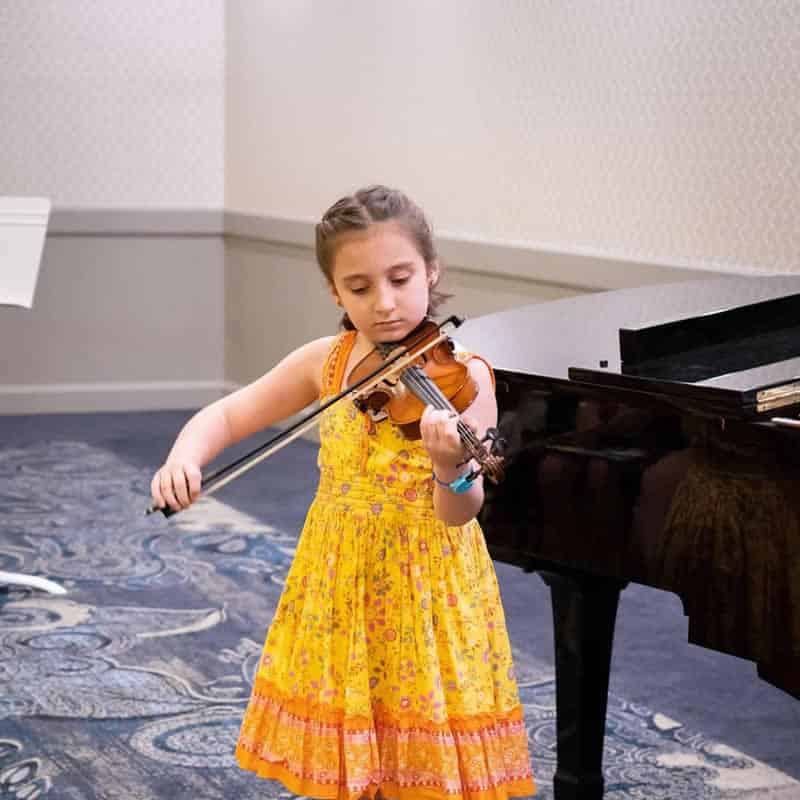 Young child enjoying their Violin Lessons Sydney at the Inner West Institute of Music