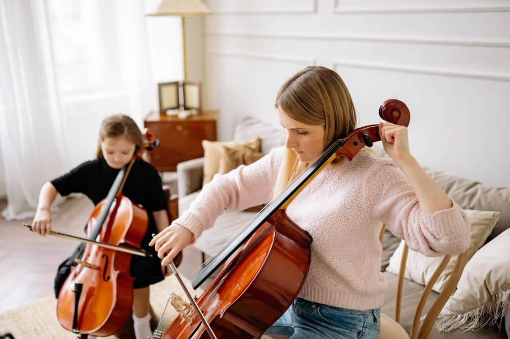 Cello teacher helping a student during a cello lesson in Sydney’s Inner West