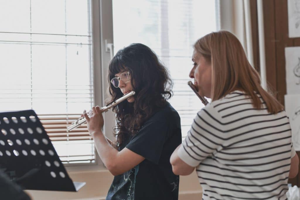 Flute teacher helping a student during a flute lesson in Sydney’s Inner West