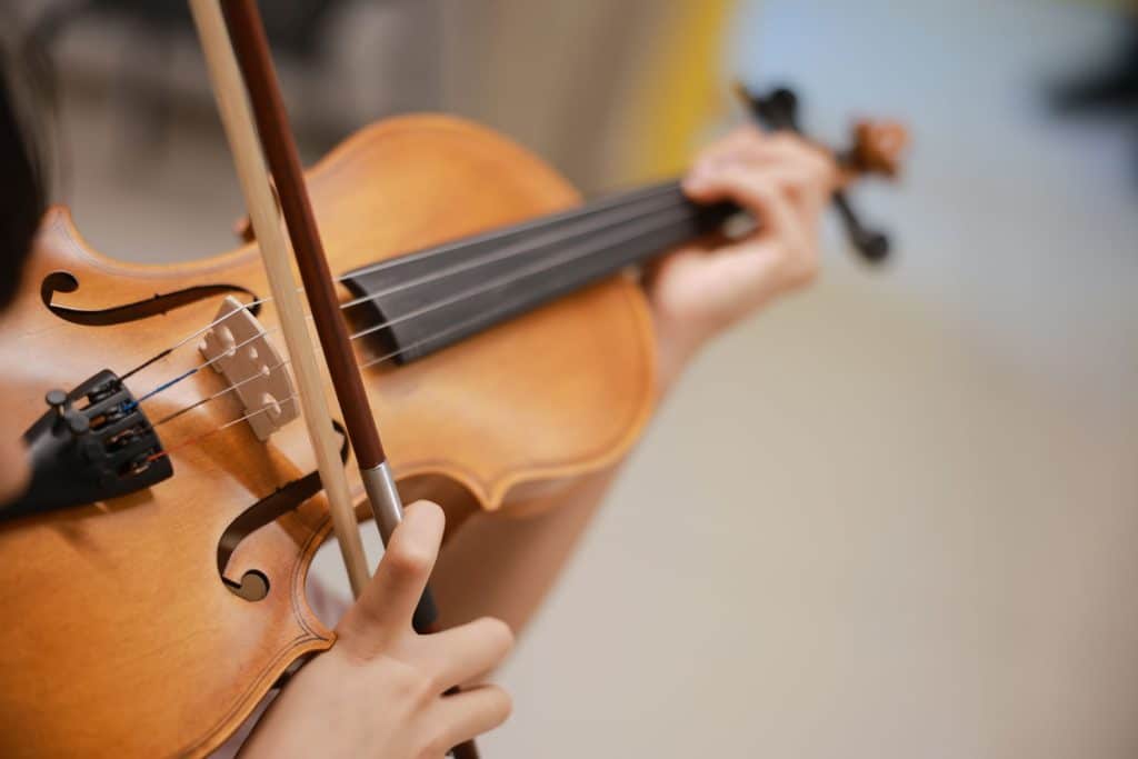 Viola teacher helping a student during a viola lesson in Sydney’s Inner West