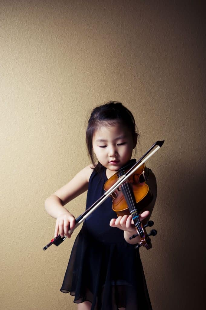 Child learning viola with a music teacher at Inner West Institute of Music